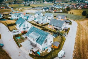 aerial view private houses with solar panels roofs